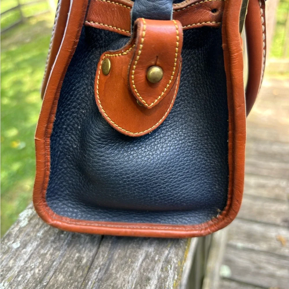 Dooney and Bourke Classic Black and Tan Vintage Leather Handbag